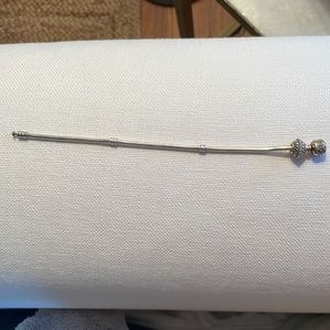 Pandora bracelet with silver charm.